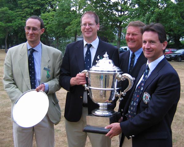 Colin Brook GM SM, Tim Bedwell, Nigel Ball SC, GC, Nick Brasier GC - The Stock Exchange Rifle Club B Team - with the Bank of England Centenary Plate and the Rifle Clubs Challenge Cup.
